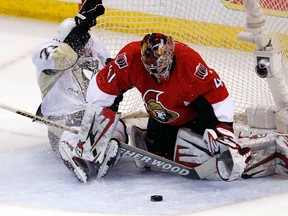 Pittsburgh Penguins' Evgeni Malkin (71) crashes into the net of Ottawa Senators' goalie Craig Anderson (41) during the first period of NHL hockey action in game three of the Stanley Cup Playoffs second round at Scotiabank Place Sunday, May 19, 2013.  Darren Brown/Ottawa Sun/QMI Agency