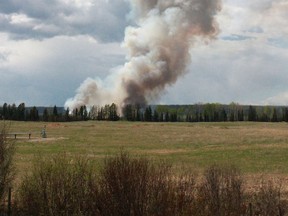 The plume of smoke from a wildfire near Groat Creek that started in the afternoon of May 18 was clearly visible along Highway 32 South. Wooldands County Peace Officers asked people not to park on the side of the highway and spectate.
Celia Ste Croix | Whitecourt Star