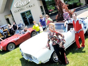 RM Auction staff, posed here with a 1948 Chrysler Town and Country, 1963 Shelby Cobra  and an 1971 Cutlass Supreme, far right, are revving up for Retrofest weekend with a number of fun events for the staff at the classic car facility. As part of Retro Day, the staff dressed up, and had a macaroni and cheese, Jell-O and dream whip dessert luncheon. Retrofest takes on a new twist with a 500-plus car cruise Friday night starting at the John D. Bradley Convention Centre and a free Trews concert Saturday in Tecumseh Park. DIANA MARTIN  / THE CHATHAM DAILY NEWS/ QMI AGENCY