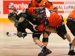 Owen Sound Quantum Properties NorthStars Mike McLeod, right, crushes St. Catharines Saints Mitch Dumont with a check during the NorthStars season opener at the Lumley Bayshore in Owen Sound in OLA senior lacrosse action on Saturday.(JAMES MASTERS The Sun Times)