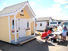 The 8th annual Playhouse Raffle launched Friday. The playhouses are on display in the Walmart parking lot. Tickets for the raffle cost $10 and can be purchased near the displays from 10 a.m. to 8 p.m. every day of the week.  Aaron Hinks/Daily Herald-Tribune