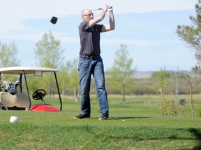 Douglas Wieterman, from Hay River, drives a golfball on the sixth hole at the Bear Creek Golf Club in Grande Prairie on Victoria Day. From open to close the course was filled with golfers eager to take advantage of the sunny weather. Aaron Hinks/Daily Herald-Tribune