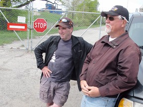 DANIEL R. PEARCE Simcoe Reformer
Locked out steelworkers John Roach (left) and Ron Bowden watch over a gate at the U.S. Steel mill at Nanticoke on Friday. The dispute is entering its fourth week.