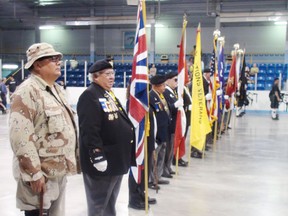 Members of the Six Nations Veterans Association stand in a colour guard at the start of the Bread and Cheese ceremony in the Gaylord Powless Arena on Monday, May 21, 2013. (MICHAEL-ALLAN MARION Brantford Expositor)