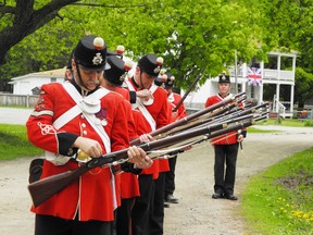 The Brockville Infantry Company prepares their arms for salute to Queen Victoria during celebrations at Upper Canada Village on Sunday.
Staff photo/CHERYL BRINK