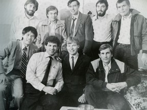 Neil Reynolds, centre back, poses for a photo with the Soviet defectors whose story was famously chronicled in the Whig by Jack Chiang, David Prosser and Mark Pleasants, shown here from left to right in the front row.