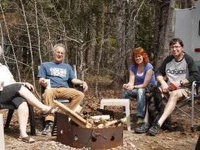 Members of the Friends of Ivanhoe Lake Provincial Park, from left, Carole Moland, Eric Moland, Shelly Desjardins and Kevin Hedican took a moment to reap the benefits of months of hard-fought work to save their beloved park