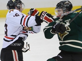 Portland Winterhawks? Nicolas Petan collides with Scott Harrington of the London Knights during the first period of their preliminary-round game at the Memorial Cup in Saskatoon on Monday night. (Al Charest QMI Agency)