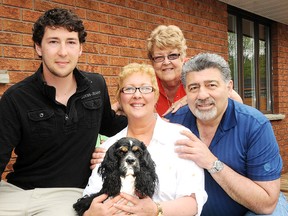 Paula Peroni with her husband Dennis son Tyler and mom Biddy Farrell holds Kinsi, the family dog, an American cocker spaniel, at her home in Coniston on Monday afternoon.

GINO DONATO/THE SUDBURY STAR