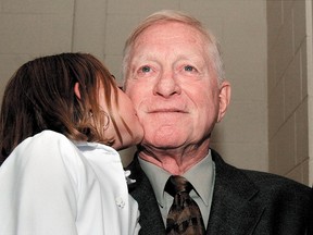 Copper Leyte is kissed by granddaughter Kennidy Castien upon his induction into the Chatham Sports Hall of Fame in 2004. (Daily News File Photo)