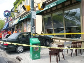A Volvo sits on the sidewalk, the front of the car embedded in a Starbucks coffee shop, after a two-vehicle accident at Central and Richmond Streets around 8:20 a.m. in London on Tuesday May 21, 2013. While police on the scene say the shop was busy with patrons at the time, one the driver of one of the vehicles was taken to hospital with non-life-threatening injuries. (CRAIG GLOVER, The London Free Press)