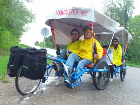 Chinese-Canadians Emily Jiang, Sean Ma and Sherry Ma of London headed out on Bruce Road 23 north of Kincardine the morning of May 21, 2013 kicking off the first few days of their 100-day cross-Canada trek. The family hopes to reach Vancouver by late August, 2013, traveling about 50km a day. (TROY PATTERSON/KINCARDINE NEWS)