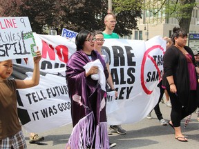 About 50 people joined a protest on the steps of Sarnia City Hall Tuesday opposing Enbridge's Line 9 Project. The company plans to use an existing pipeline to carry diluted bitumen from the Alberta tar sands, through Sarnia to Eastern Canada. (LIZ BERNIER, The Observer)