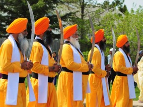 The Honour Guard stands together during the 2013 Nagar Kirtan Parade in Mill Woods on Sunday, May 19, 2013. Tens of thousands of local Sikhs came out for the parade which commemorates the establishment of the Khalsa. TREVOR ROBB/EDMONTON EXAMINER