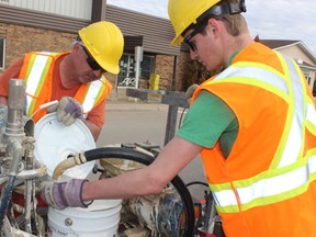 A crew from the City of Melfort had to refill their paint while working on painting lines on Main Street on Thursday, May 16.