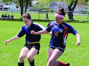 Stephanie Boulay of the Jeanne-Lajoie Chevaliers tries to get the ball away from a member of the Madawaska Valley Wolves during senior girls soccer action at Riverside Park May 14. Jeanne-Lajoie earned a 1-0 win in the game. For more community photos, please visit our website photo gallery at www.thedailyobserver.ca.