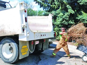 Town crews are busy this week with the annual community spring cleanup. Here, Justin Vallee loads up some branches Tuesday, May 21, on the first day of the cleanup, which continues until Friday, May 24. Metal, wood waste, tree branches, rocks and cardboard need to be separated as per waste commission requirements. Anyone interested in taking advantage of the free service can contact 403-485-2417. Call a day in advance to arrange a pick up time.