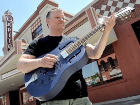 Local guitarist Tom Lockwood, organizer of the first-ever Bluesfest, is shown in front of the St. Clair College Capitol Theatre, in Chatham, On.,  on Tuesday May 21, 2013. The June 1 event will feature performances from local and visiting musicians, along with workshops.  DIANA MARTIN/ THE CHATHAM DAILY NEWS/ QMI AGENCY