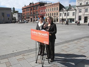 Local NDP candidate Mary Rita Holland looks on as provincial party leader Andrea Horwath speaks during a visit to Kingston in 2012.