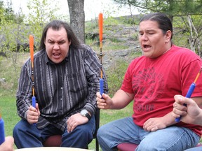Terence McNichol, left, and Harvey Bell, of High Eagle, take part in a Sacred Fire Arbour Awakening ceremony at Cambrian College in Sudbury, ON. on Thursday, May 16, 2013. The arbour will be used for future prayers, workshops, teachings and ceremonies. JOHN LAPPA/THE SUDBURY STAR/QMI AGENCY