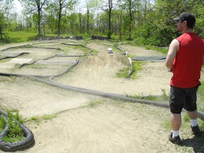 John Primeau surveys a remote-controlled car track in Guindon Park on Saturday, May 18. He is part of a group hoping to re-open the track to the public later this summer.

CHERYL BRINK/CORNWALL STANDARD-FREEHOLDER/QMI AGENCY