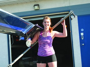 Missy Wilcox carries one of the rowng boats out from the Kenora Rowing Club towards Rabbit Lake. Wilcox will be joining the rowing club’s coaching staff for the 2013 season after returning for the summer from rowing with Brock University.