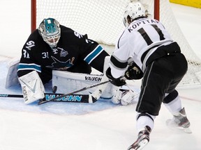 San Jose Sharks goalie Antti Niemi (31) makes a third period save on Los Angeles Kings center Anze Kopitar (11) during Game 4 of their NHL Western Conference semi-final playoff hockey game in San Jose, California May 21, 2013. REUTERS/Robert Galbraith