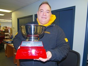 Drumheller Titans defensive co-ordinator and Alberta Rising Stars head coach Ron Laprise holds the ABC Border Bowl trophy. PHOTO SUPPLIED Drumheller Mail