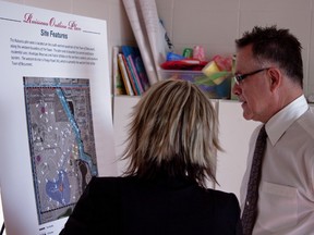 The mayor, Camille Bérubé, speaking with Reanna Feniak, the Project Manager at Qualico Communities, at the Ruisseau Community Outline Open House at the Aquafit Centre on May 8. Feniak and Chuck McNutt, a Senior Manager, Planning from Focus Corporation, were available to answer questions. ADAM HODNETT QMI AGENCY