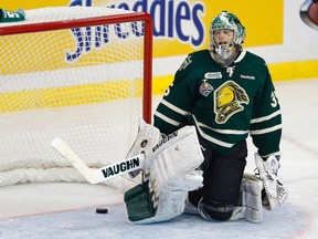 London Knights' goalie Jake Patterson reacts to a goal scored on him by Halifax Mooseheads' Martin Frk during the first period of the Memorial Cup Canadian Junior Hockey Championships in Saskatoon, Saskatchewan, May 21, 2013. REUTERS/Todd Korol  (CANADA - Tags: SPORT ICE HOCKEY)