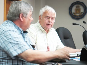 Coun. Gerald Samson (right) and George Tigiannis, owner of Cornwall Barbecue, speak to the media on Wednesday regarding the long lines at the city’s port-of-entry that have hurt business.
Staff photo/CHERYL BRINK