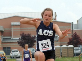 Jenna McCurdy from Assumption College competes in the junior girls triple jump Wednesday at Day 1 of the Central Western Ontario Secondary School Association track and field championships at Jacob Hespeler Secondary School in Cambridge. (DARRYL G. SMART, The Expositor)