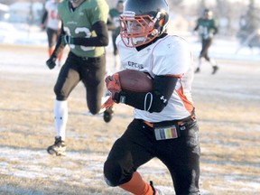 Marcus Cooper scampers in for a 50-yard touchdown reception against the Spruce Grove Panthers in Cooper’s final football game as a member of the Grande Prairie Composite Warriors. He will suit up for the Okakagan Sun of the Canadian Junior Football League’s BC Football Conference this summer.
TERRY FARRELL/DAILY HERALD-TRIBUNE