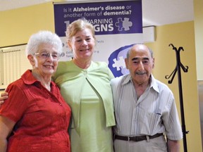 Mary Burnett (centre), CEO of the Alzheimer Society of Brant, poses with Connie and Peter Humpartzian at an open house Wednesday to mark the opening of the society's new home on Bell Lane Terrace at the John Noble Home. (VINCENT BALL, The Expositor)