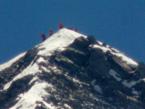 A team of climbers, including 80-year-old Japanese mountaineer Yuichiro Miura, stand on the summit of Mount Everest, in this photo taken by Kyodo May 23, 2013. REUTERS/Kyodo