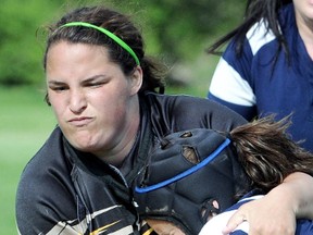 Amber Nicholas, left, and the Blenheim Bobcats lost 19-12 to the St. Christopher Cyclones in the SWOSSAA 'A-AA' girls rugby final Wednesday in Blenheim. (Daily News File Photo)