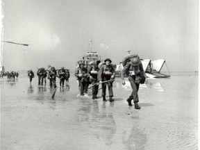 Canadian troops landing at Juno beach, D-Day 6 June 1944 .
   (Photo courtesy of National Archives)