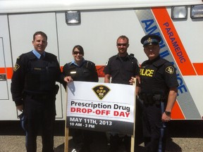 Aux. Constable Bernard Ethier, Aux. Constable Lisa Gauther, EMS paramedic Justin Malo and Community Services Officer Alain Cloutier were outside the Cochrane OPP detachment on May 11 collecting prescription drugs. Also present but not pictured was Porcupine Health Unit nurse Karen Belair Girard.