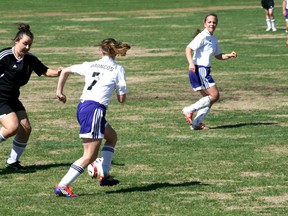 Maddie Trudeau sprints down the middle of the field while a teammate gets ready for a pass during the Beaver Brae girls’ 1-0 win over Fort Frances. The Broncos finished in first place with two wins against Fort Frances and Dryden and will head to Dryden next Wednesday for the NorWOSSA championships and a chance to go to OFSAA.