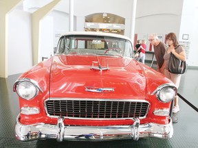 A couple inspects the 1955 Chevy Nomad during the opening weekend of the Fabulous Fifties exhibit  at Reynolds-Alberta Museum May 18.