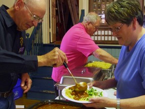 Lion Ed Kanis dishes out the sauce to Bonnie Davidson during the Italian Feast at the Norwood Town Hall. The dinner is one of many annual fundraising events with proceeds going towards such community events/improvements as the Asphodel Norwood Splashpad.