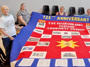 Women from the Salvation Army have made a commemorative quilt featuring piecing by Fairholme Hutterity Colony. Pictured are Verna Emberly, left, Marjorie Oldford, Lauri Klyne, Valerie Hill and Josephine Winter. (CLARISE KLASSEN/PORTAGE DAILY GRAPHIC/QMI AGENCY)