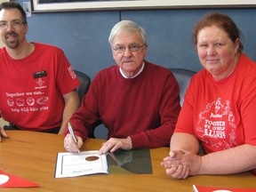 City hall has declared May 25 as Jump Start Day in Timmins. Canadian Tire in Timmins will host a Jump Start Day on Saturday, May 25, from 10 a.m. to 4 p.m. There will be activities organized with local partners to the Jump Start Program, including the Timmins Family YMCA, Extend-a-Family, the Therapeutic Riding Association and KidSport. There will be a fundraising barbecue at the store, with proceeds helping the local Jump Start chapter. This event will not only raise funds for the program, but will raise awareness within the community that this program is available to those families who need it most. Since the program started in 2005, the local chapter has helped 1,179 children enrol in sports and recreation in the community. In 2012 alone it was able to help 441 children. Taking part in the signing of the declaration are, from left, Alain Racette, Timmins Canadian Tire store manager; Coun. Mike Doody; and Jane White, store manager.