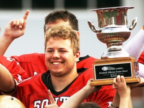 South’s Joshua Gingrich-Hadley celebrates with the team and trophy after the Football Alberta Senior Bowl game played at McMahon Stadium, May 20, with the South winning 31-19.
