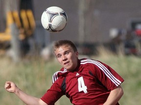 Cochrane Cobras Michael Lara heads the ball during CHS 11-0 drubbing of Chestermere.