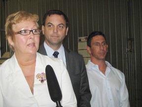 Flanked by Sudbury candidate Paula Peroni and Anthony Grossi, PC leader Tim Hudak takes aim at the Liberals and NDP during a visit to Sudbury last  year.
File photo