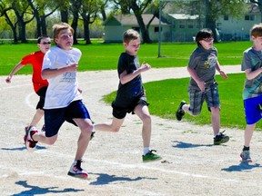 Runners participate in the 100-metre dash at the La Verendrye School track meet Thursday. (KEVIN HIRSCHFIELD/THE GRAPHIC/QMI AGENCY)
