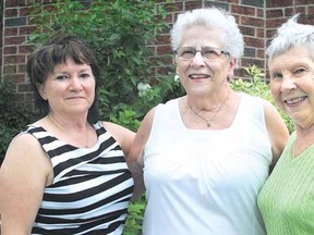 Joyce Blowers, centre, is shown here with members of her birth family including sister Valerie Davis, left, and aunt Nelda Mossip-Oliver after being separated for nearly 73 years. (LAURA CUDWORTH The Beacon Herald)