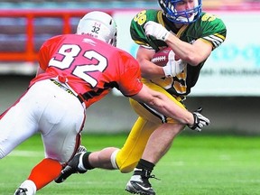 Ardrossan Bisons running back Jimmy Airey makes a move during last weekend’s Senior Bowl for graduating high school players at McMahon Stadium in Calgary. Darren Makowichuk QMI Agency