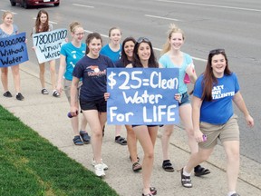 DANIEL R. PEARCE Simcoe Reformer
Students from Holy Trinity Catholic High School walked from their school on Evergreen Hill Road to the Wal-Mart on Queensway East on Thursday to raise public awareness about the lack of clean drinking water in Third World countries. The walk also raised about $600 for Free the Children clean water programs.